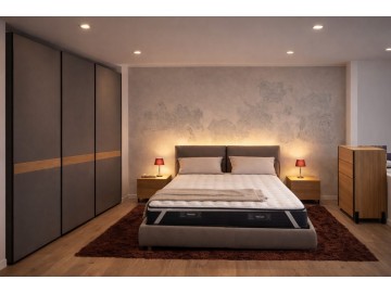 Camera matrimoniale con letto imbottito e armadio scorrevole